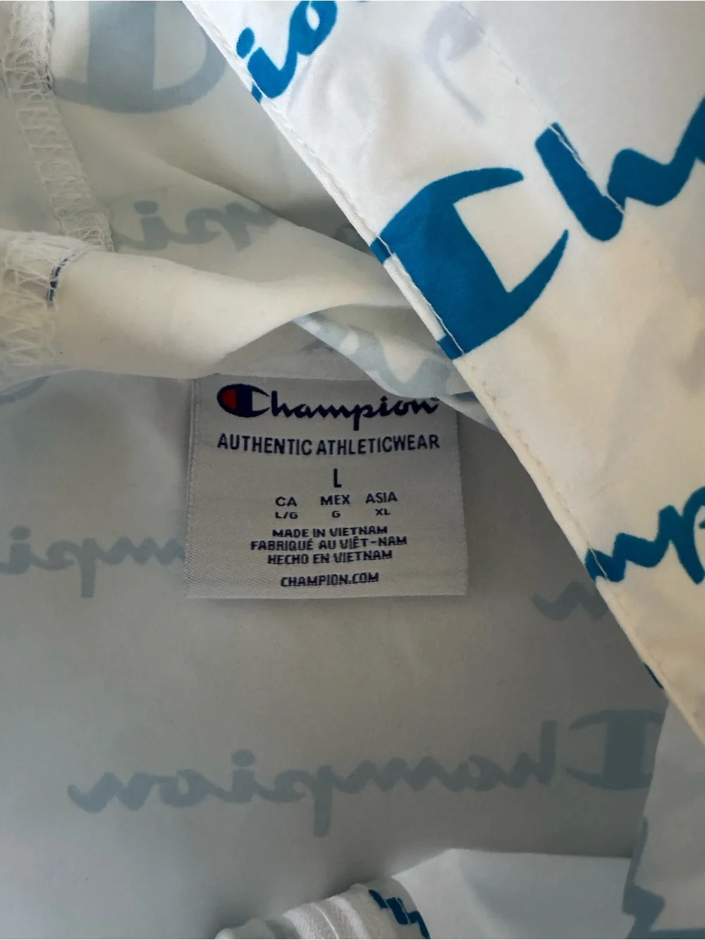 Champion Cream Pullover Hoodie with Blue Logo All-Over Print